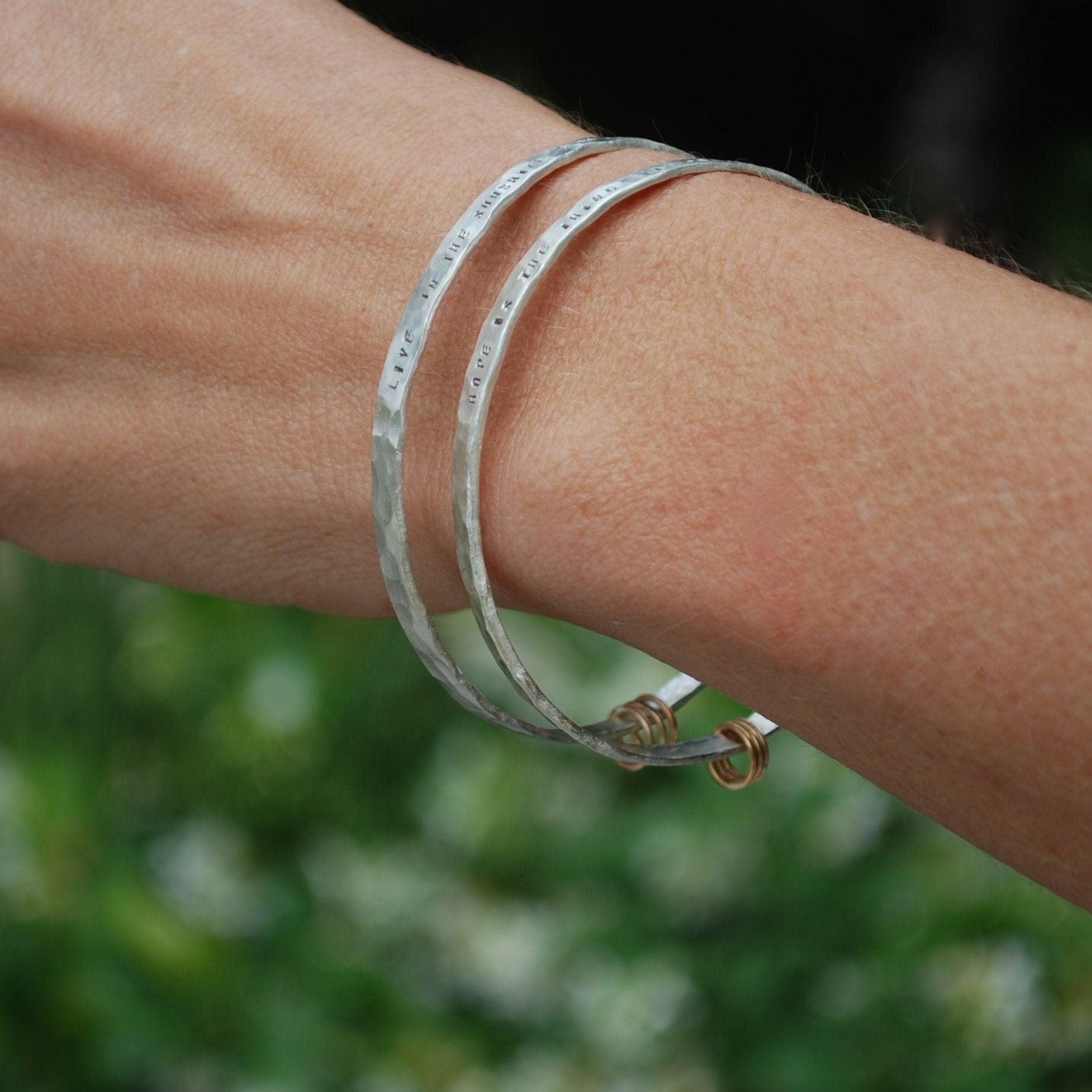 "Hope is the thing with feathers" -Emily Dickinson three ring bangle bracelet - ItemBear.com