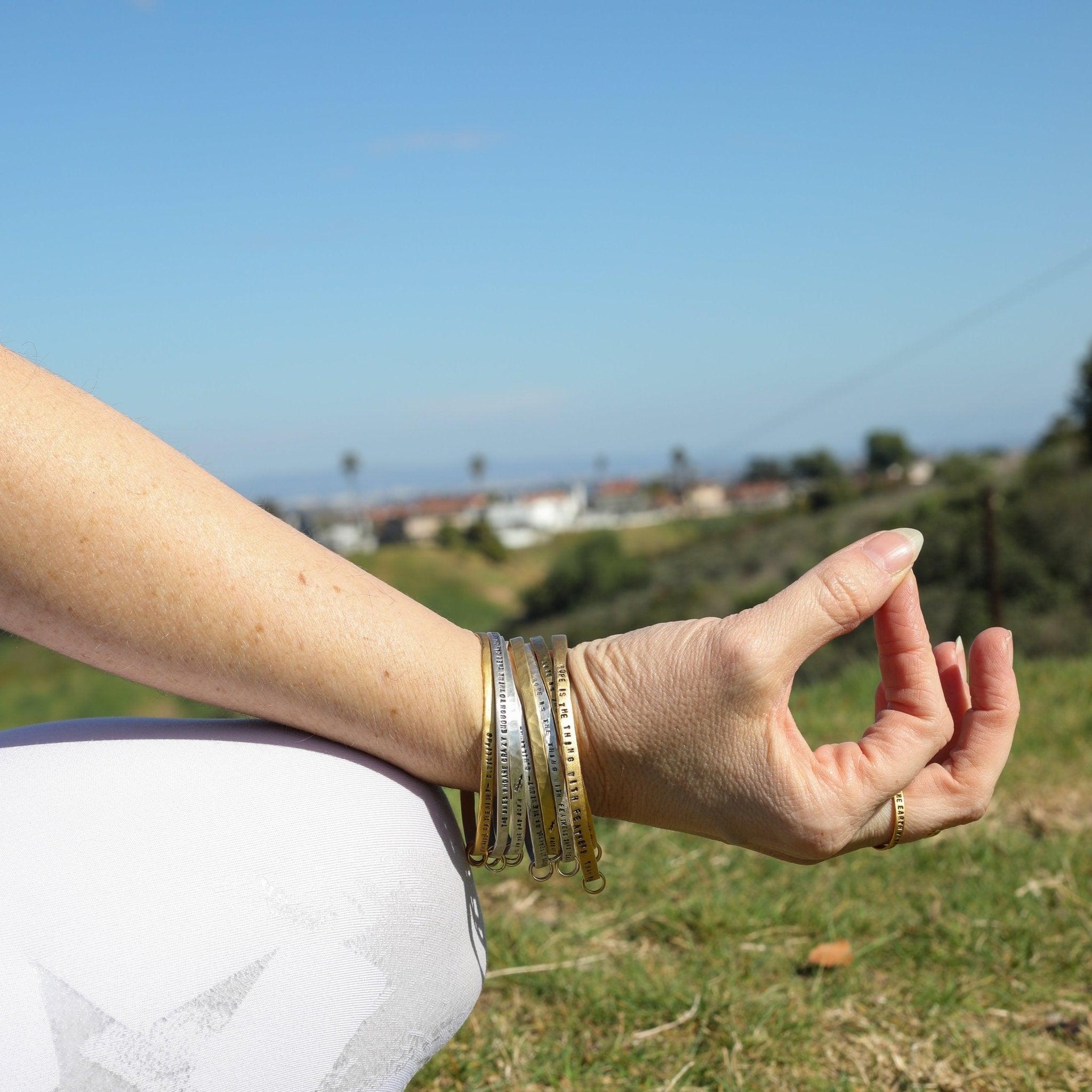 "Hope is the thing with feathers" -Emily Dickinson three ring bangle bracelet - ItemBear.com