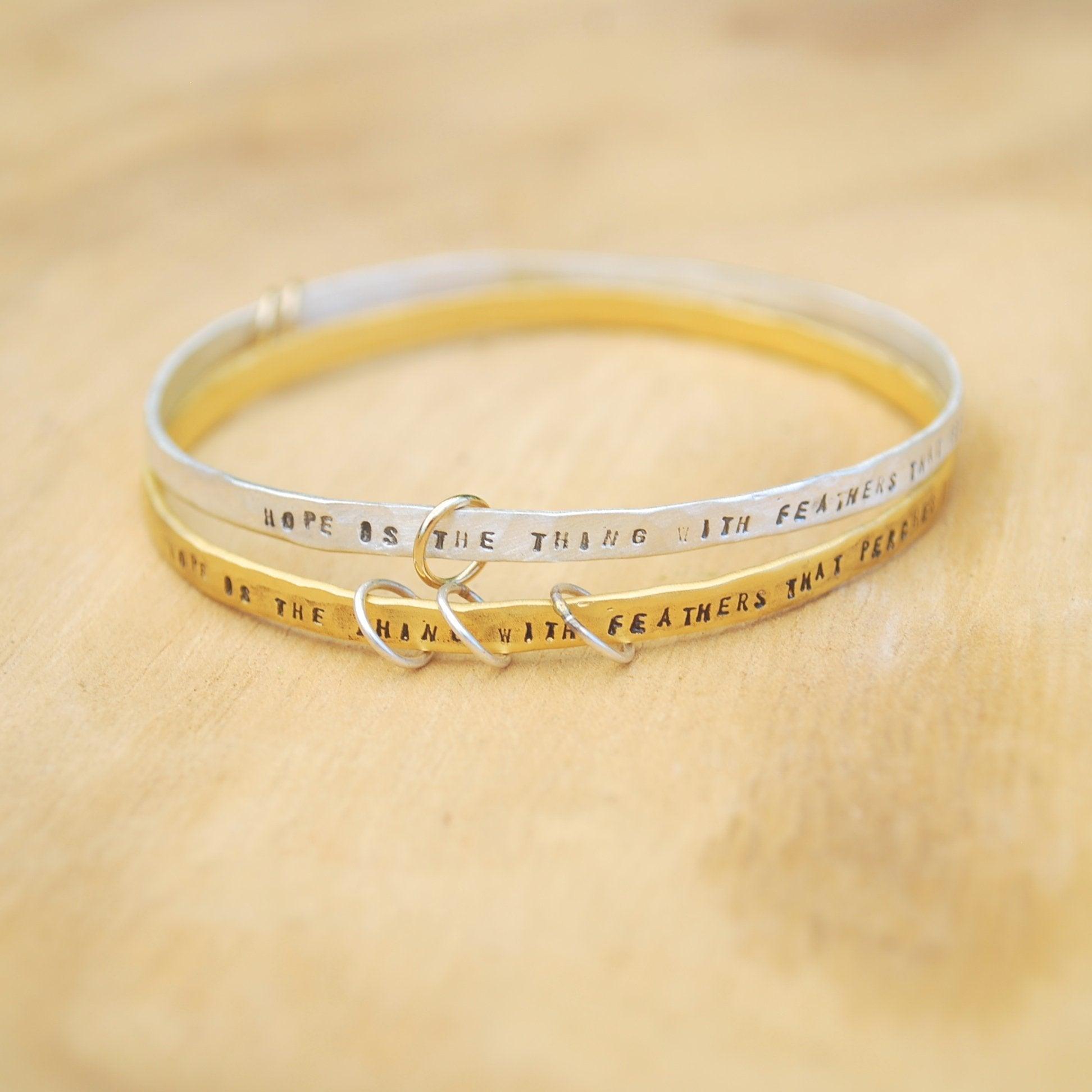 "Hope is the thing with feathers" -Emily Dickinson three ring bangle bracelet - ItemBear.com